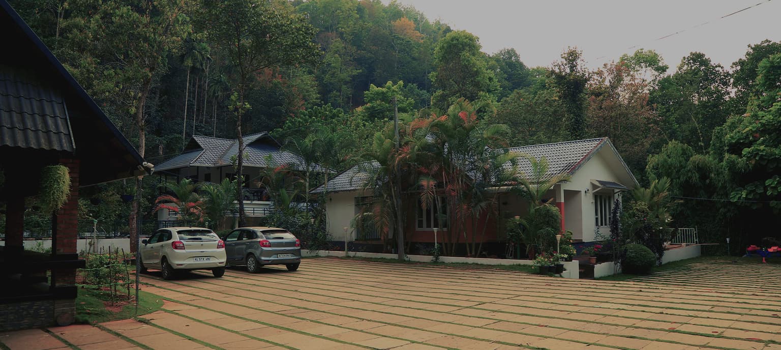Panoramic view of Brook Valley Resort surrounded by lush Wayanad greenery